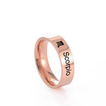 Rose gold ring with 'Scorpio' engraving on a white background