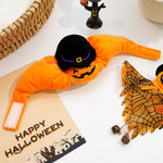 Halloween-themed dog toy with a pumpkin design on an orange bag labeled 'Happy Halloween'.