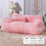 Pink pet bed with specifications on a beige carpet