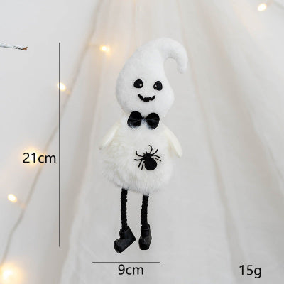 White ghost plush toy with black details on a white background