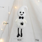 White ghost plush toy with black details on a white background