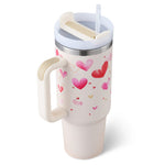 Travel mug with heart designs on a white background