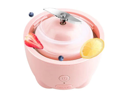 Pink kitchen appliance with fruit slices on a white background
