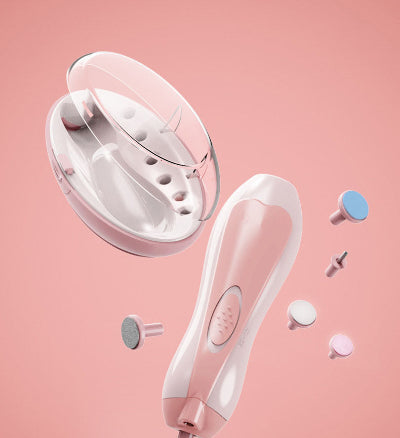 White handheld device with attachments on a pink background