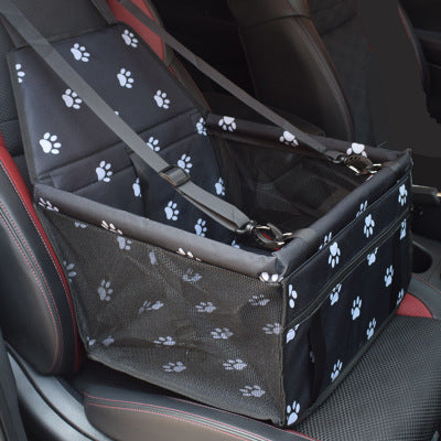 Pet carrier with paw print pattern on a car seat