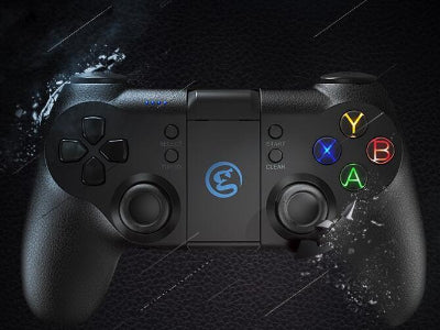 Black gaming controller with colorful buttons on a dark textured background