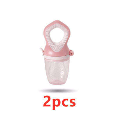 Pink baby food grinder with clear container on a white background