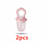 Pink baby food grinder with clear container on a white background