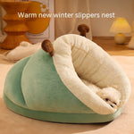 Green and white pet bed with a dog inside, labeled 'Warm new winter slippers nest'.