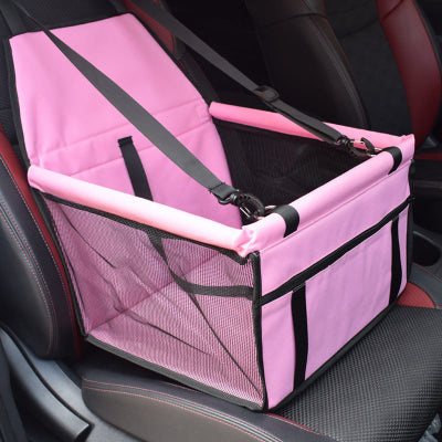 Pink pet car seat with straps on a car seat