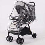 Black stroller with a clear rain cover on a white background