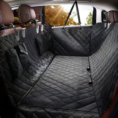 Car interior with a black quilted bench seat cover