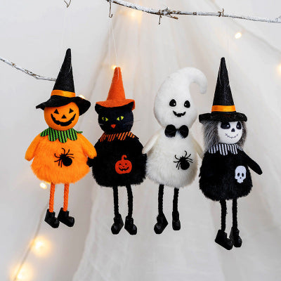 Four Halloween-themed plush toys including a pumpkin, cat, ghost, and witch on a white background with string lights.