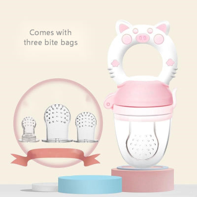 Pink baby feeder with cat ears and three bite bags on a beige background