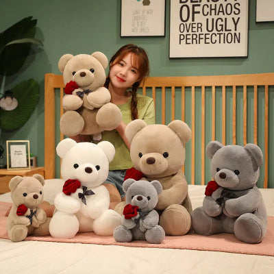 Woman holding a collection of teddy bears in a room with decorative elements.