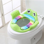 Colorful frog-shaped toilet seat on a white toilet