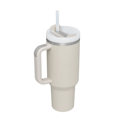 Beige tumbler with handle and straw lid on a white background