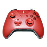Red gaming controller on a white background