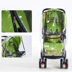 Green stroller with a transparent rain cover on a white background