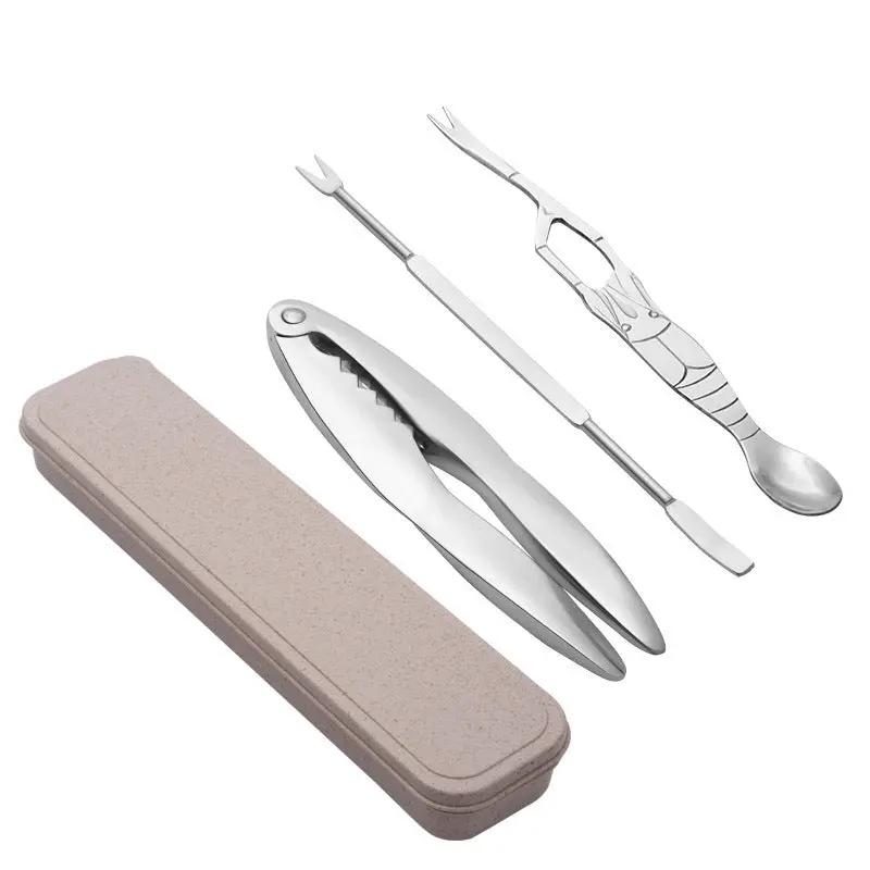 Set of silver cutlery with a beige case on a white background