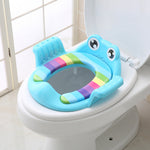 Children's toilet seat with a colorful design on a white toilet.
