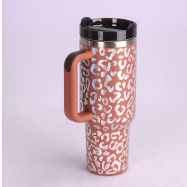 Travel mug with a leopard print pattern on a light purple background