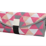 Patterned pouch with geometric design on a white background