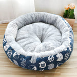 Pet bed with blue and white pattern on a wooden floor
