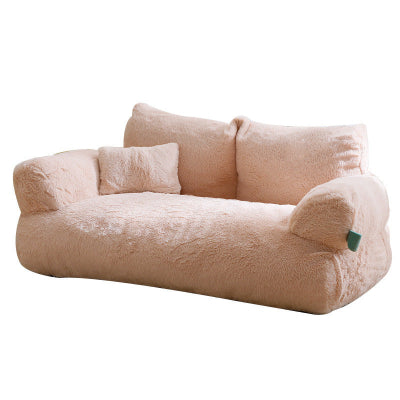 Beige plush pet bed on a white background