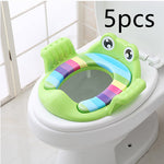 Colorful frog-shaped toilet seat on a white toilet with '5 pcs' text above.