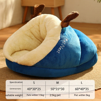 Blue pet bed with deer antlers on a wooden floor, featuring a size chart.