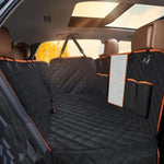 Car interior with a black and orange pet bench cover.