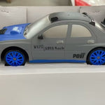 Toy car with 'W75 Super Muscle' branding in a box