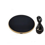Black and gold wireless charging pad with a cable on a white background