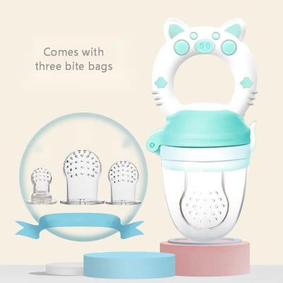 Teal and white baby pacifier with bite bags on a beige background