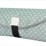 Foldable picnic mat with polka dot pattern on a white background