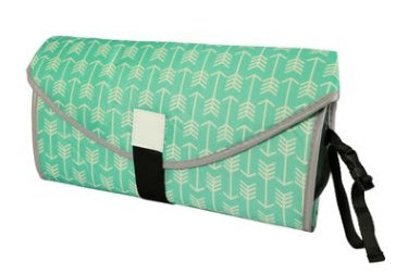 Green clutch bag with arrow pattern on a white background