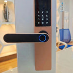 Digital door lock on a white door with a blurred indoor background