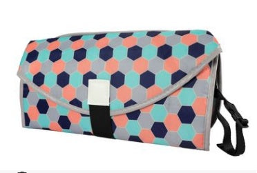 Colorful hexagonal patterned clutch bag on a white background
