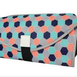Colorful hexagonal patterned clutch bag on a white background