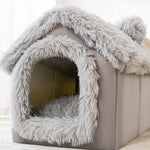 Gray pet bed with fluffy texture on a light background