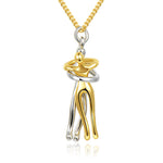 Gold and silver pendant on a chain against a white background