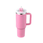 Pink insulated mug with handle and straw on a white background