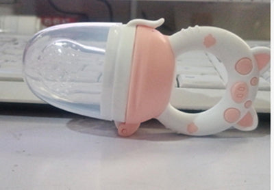 White and pink cat-shaped object on a white surface with a blurred background