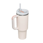 White tumbler with a handle and straw on a white background