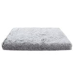 Gray fluffy pet bed on a white background