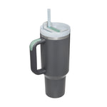 Gray insulated mug with handle and straw lid on a white background