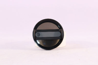 Black circular object with a reflective surface on a white background