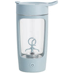 Light blue portable blender with clear container on a white background
