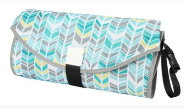 Foldable picnic blanket with chevron pattern on a white background